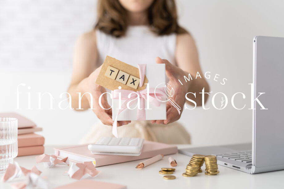 Financial Stock Images - Working out taxes from home-Desktop items.