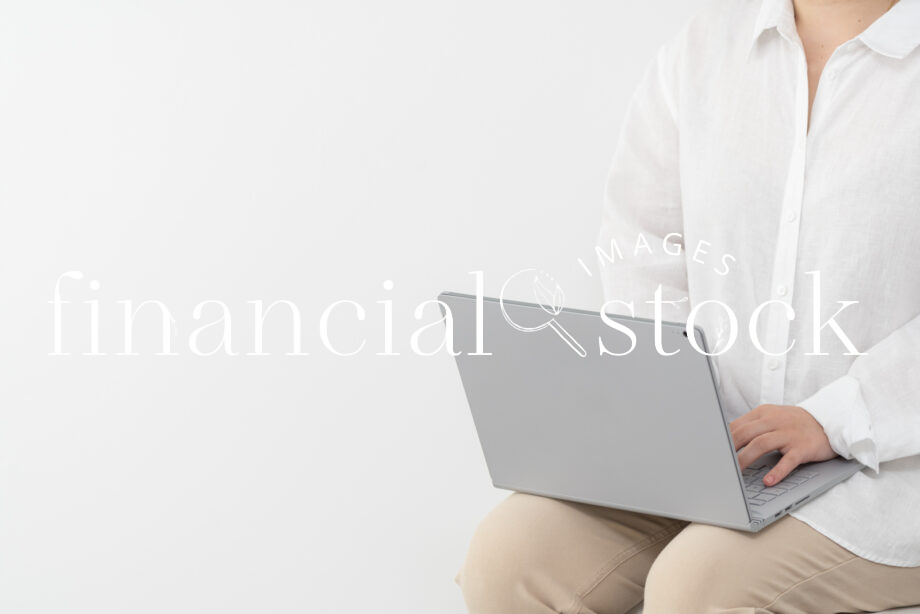Financial Stock Images - Copyspace- Woman working from home-beige-laptop, typing, studying, female.