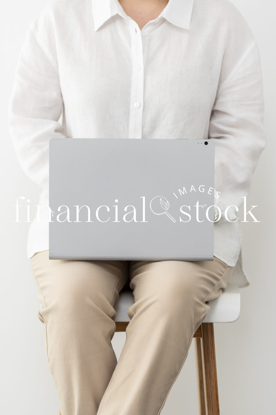 Financial Stock Images - Woman working from home-beige-laptop, typing, studying.