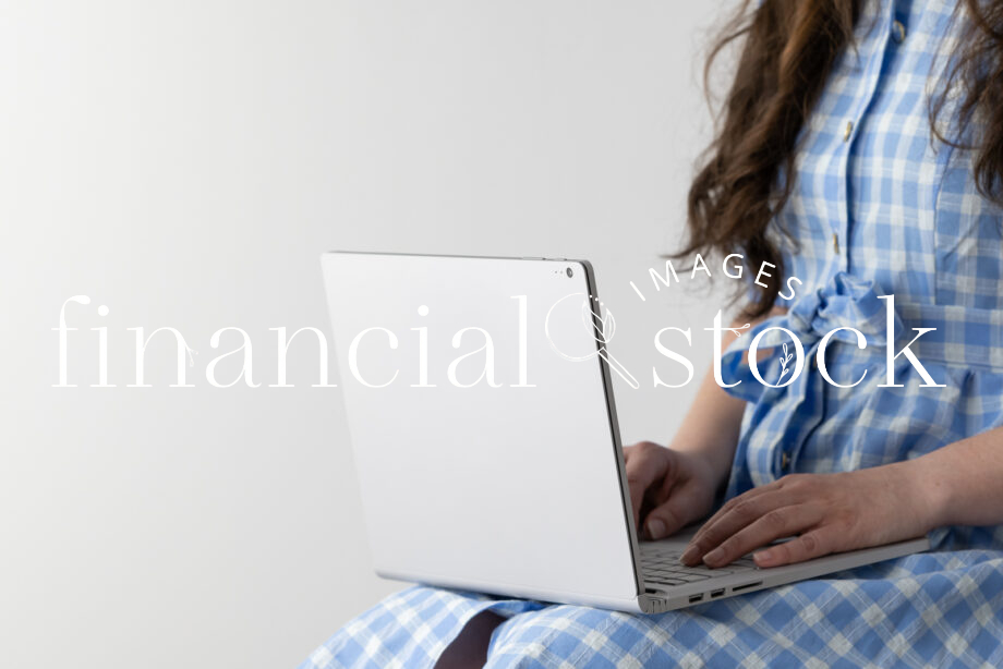 Financial Stock Images - Working from home using a laptop for business..