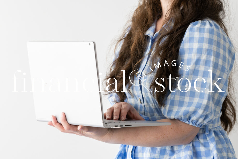 Financial Stock Images - Working from home using a laptop for business..