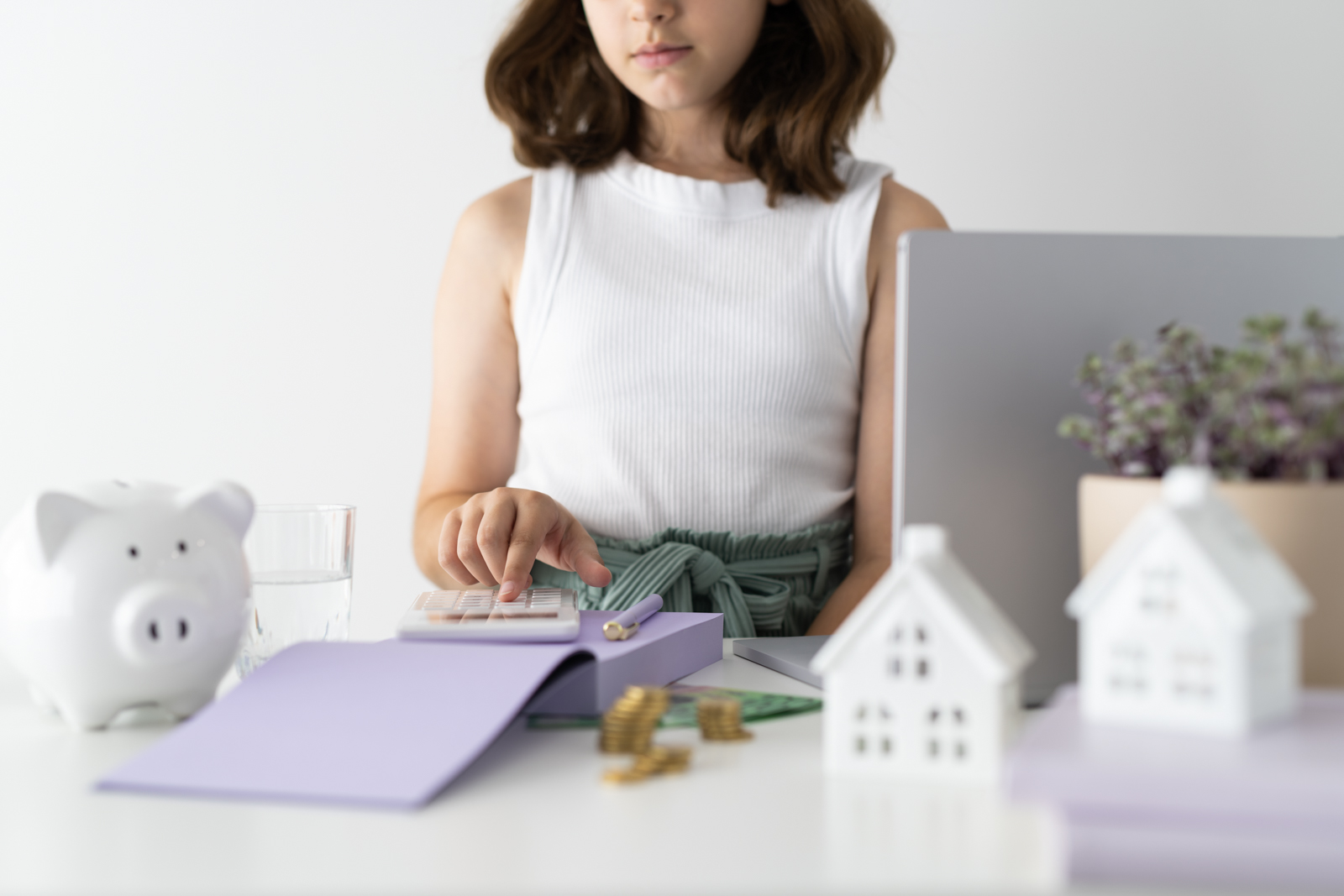 Financial Stock Images - Young female entrepreneur working out her finances and assets