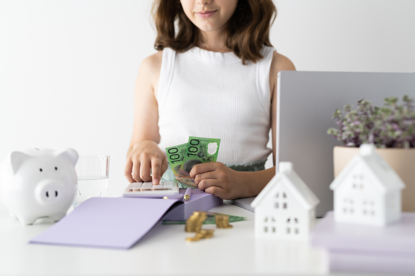 Financial Stock Images - Young female entrepreneur working out her finances and assets