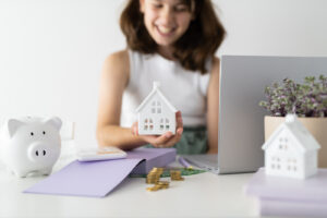 Financial Stock Images - Young female entrepreneur working out her finances and assets