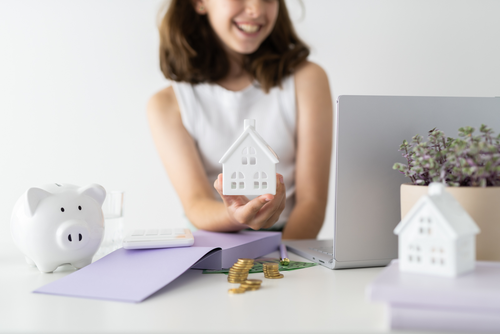 Financial Stock Images - Young female entrepreneur working out her finances and assets