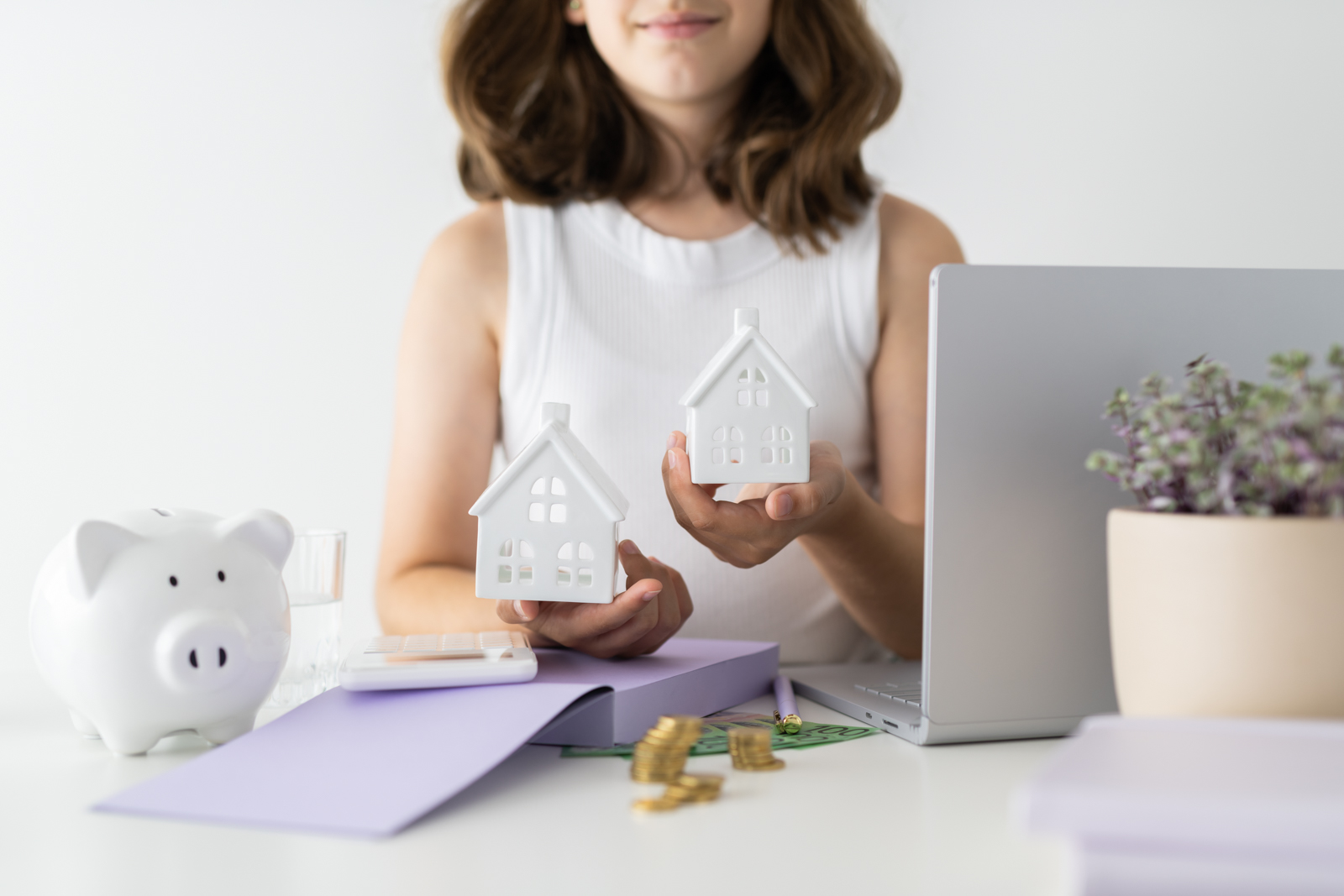 Financial Stock Images - Young female entrepreneur working out her finances and assets