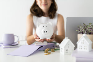 Financial Stock Images - Young female entrepreneur working out her finances and assets