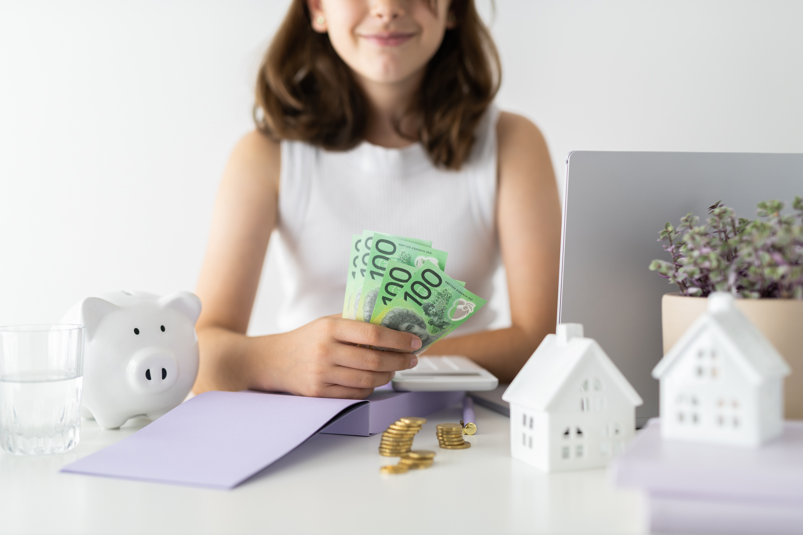 Financial Stock Images - Young female entrepreneur working out her finances