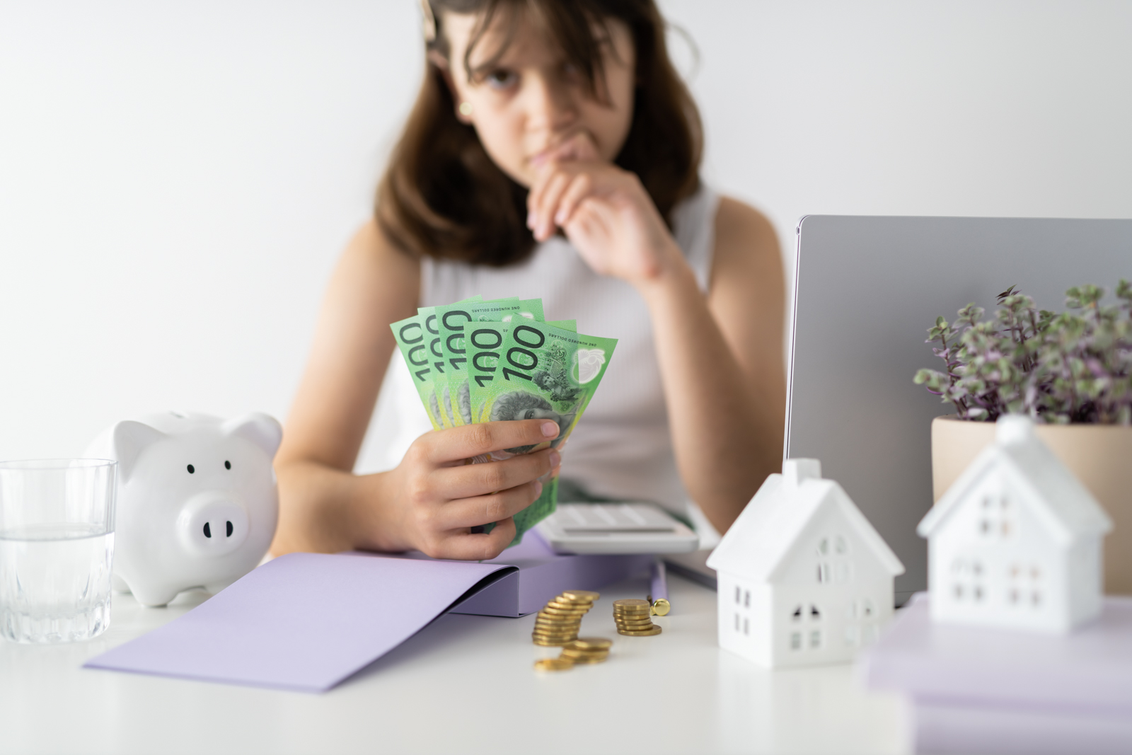 Financial Stock Images - Young female entrepreneur working out her finances