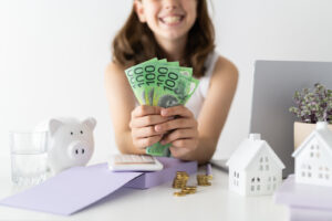 Financial Stock Images - Young female entrepreneur working out her finances