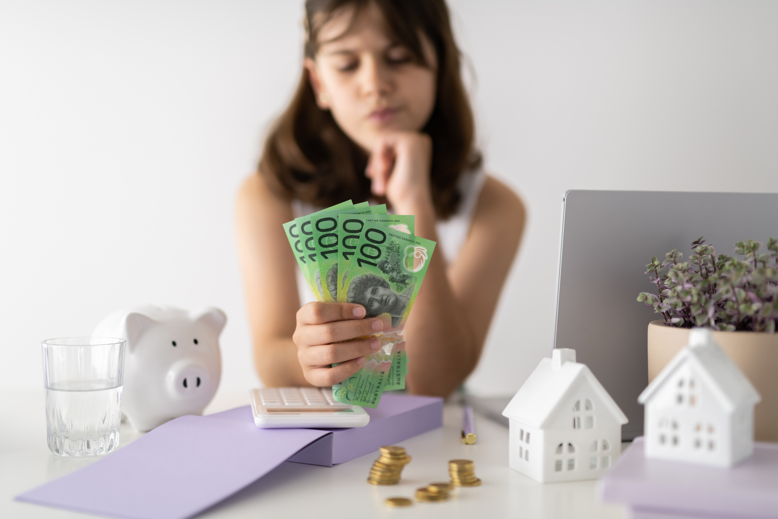 Financial Stock Images - Young female entrepreneur working out her finances