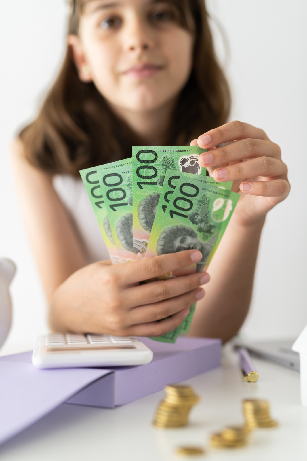 Financial Stock Images - Young female entrepreneur working out her finances