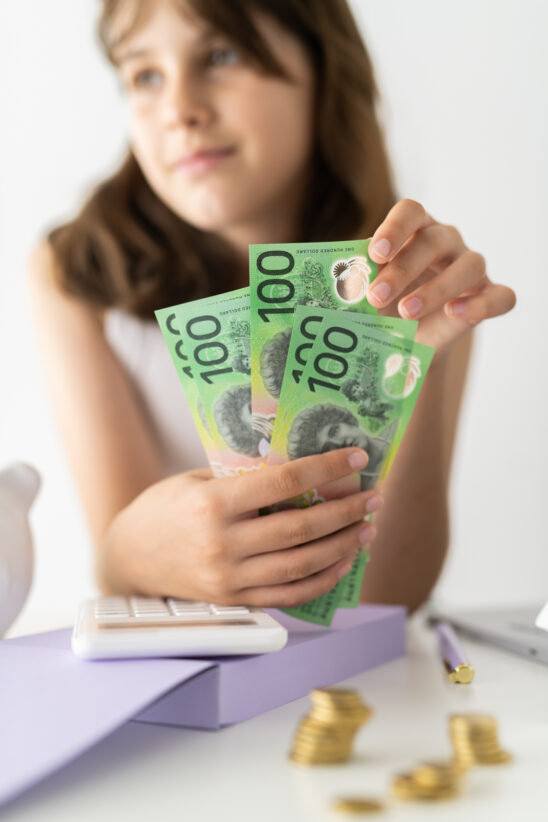 Financial Stock Images - Young female entrepreneur working out her finances