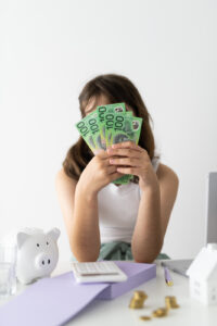 Financial Stock Images - Young female entrepreneur working out her finances