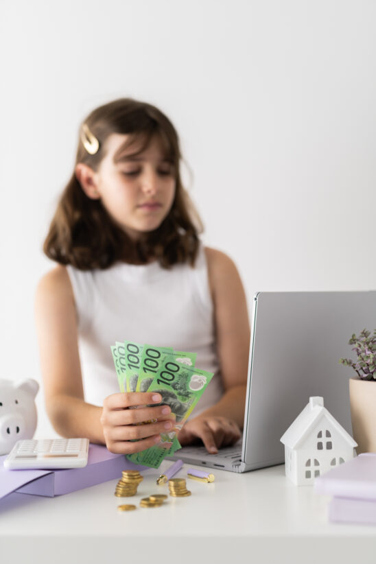 Financial Stock Images - Young female entrepreneur working out her finances