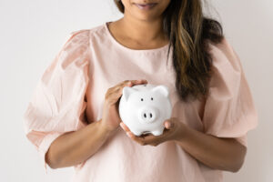 Financial Stock Images - Female entrepreneur working out her savings.
