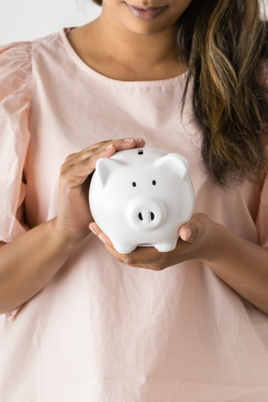 Financial Stock Images - Female entrepreneur working out her savings.