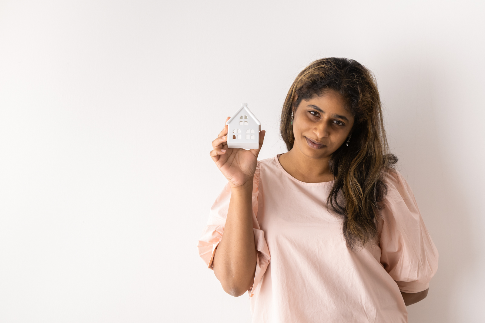 Financial Stock Images - Female entrepreneur working out her home finances.