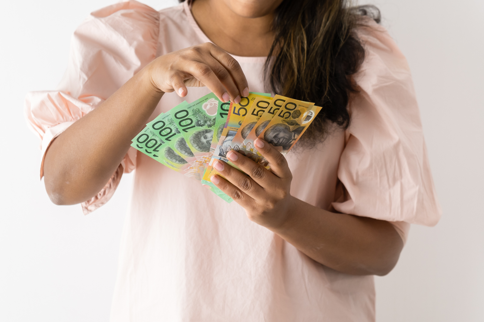 Financial Stock Images - Female entrepreneur working out her finances.