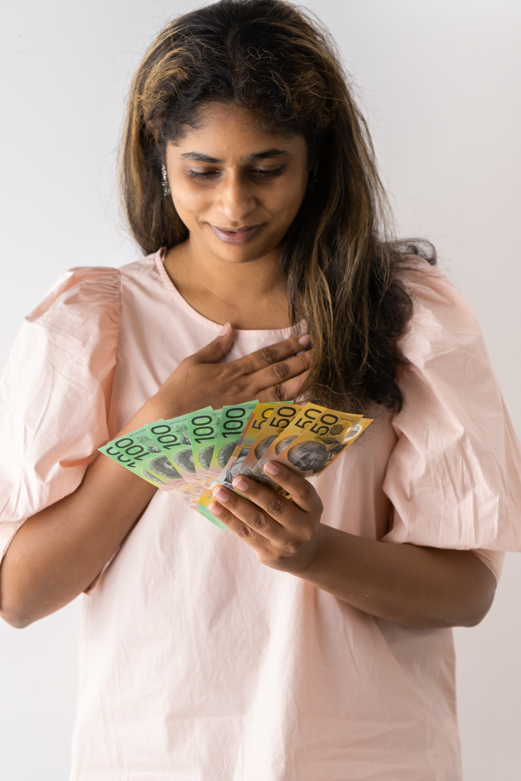 Financial Stock Images - Female entrepreneur working out her finances.