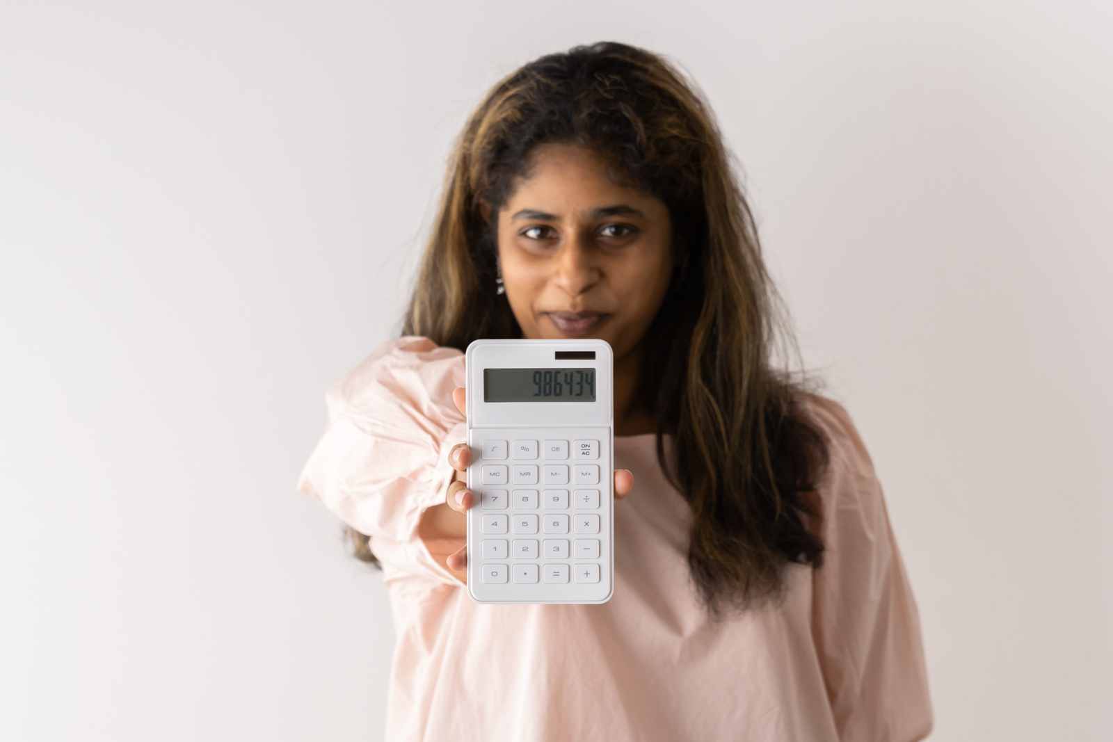 Financial Stock Images - Female entrepreneur working out her finances.