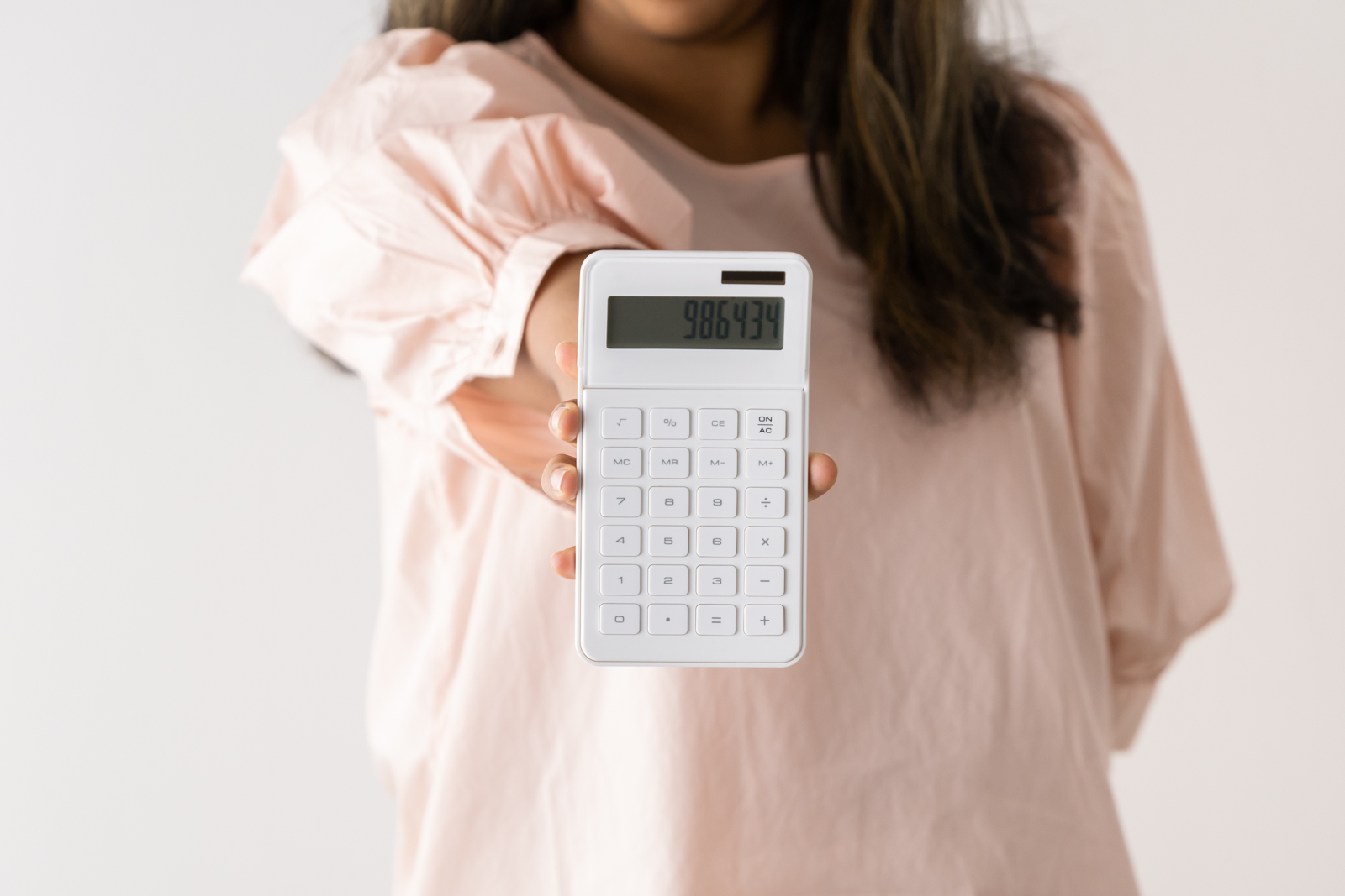 Financial Stock Images - Female entrepreneur working out her finances.