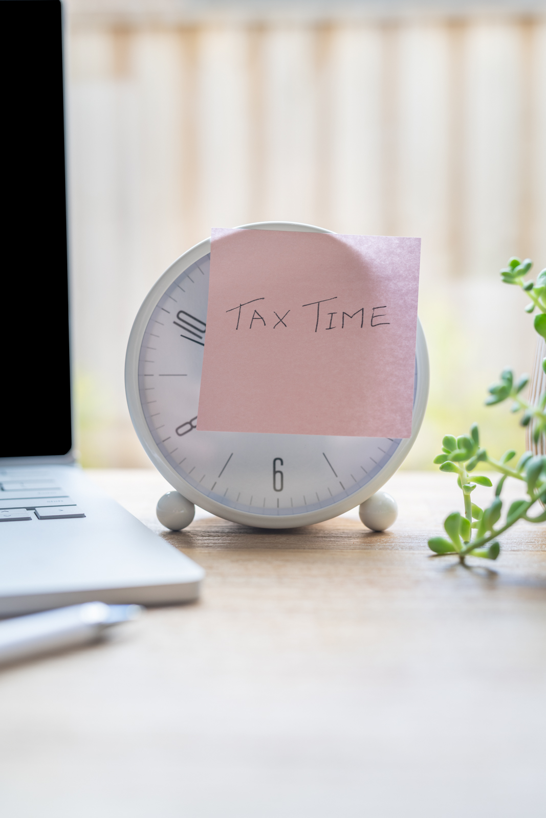 Financial Stock Images - Working out taxes from home.