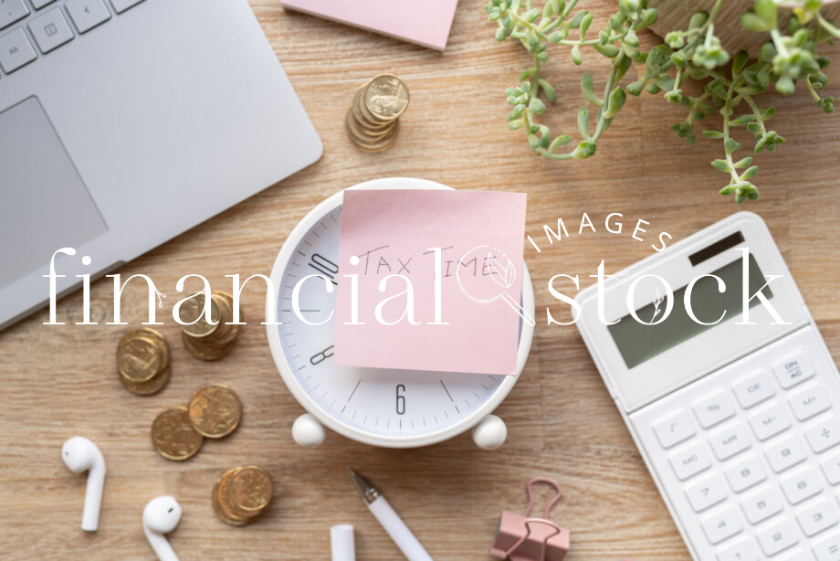 Financial Stock Images - Working out taxes from home.